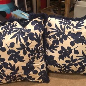 Two blue and white flower pillows